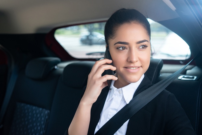 portrait business woman talking phone her way work car business concept